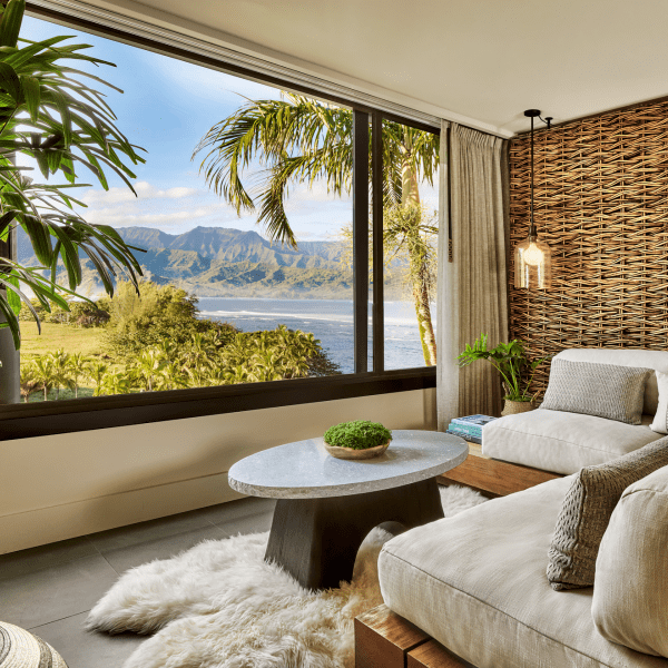 a room with large windows and a beach-view